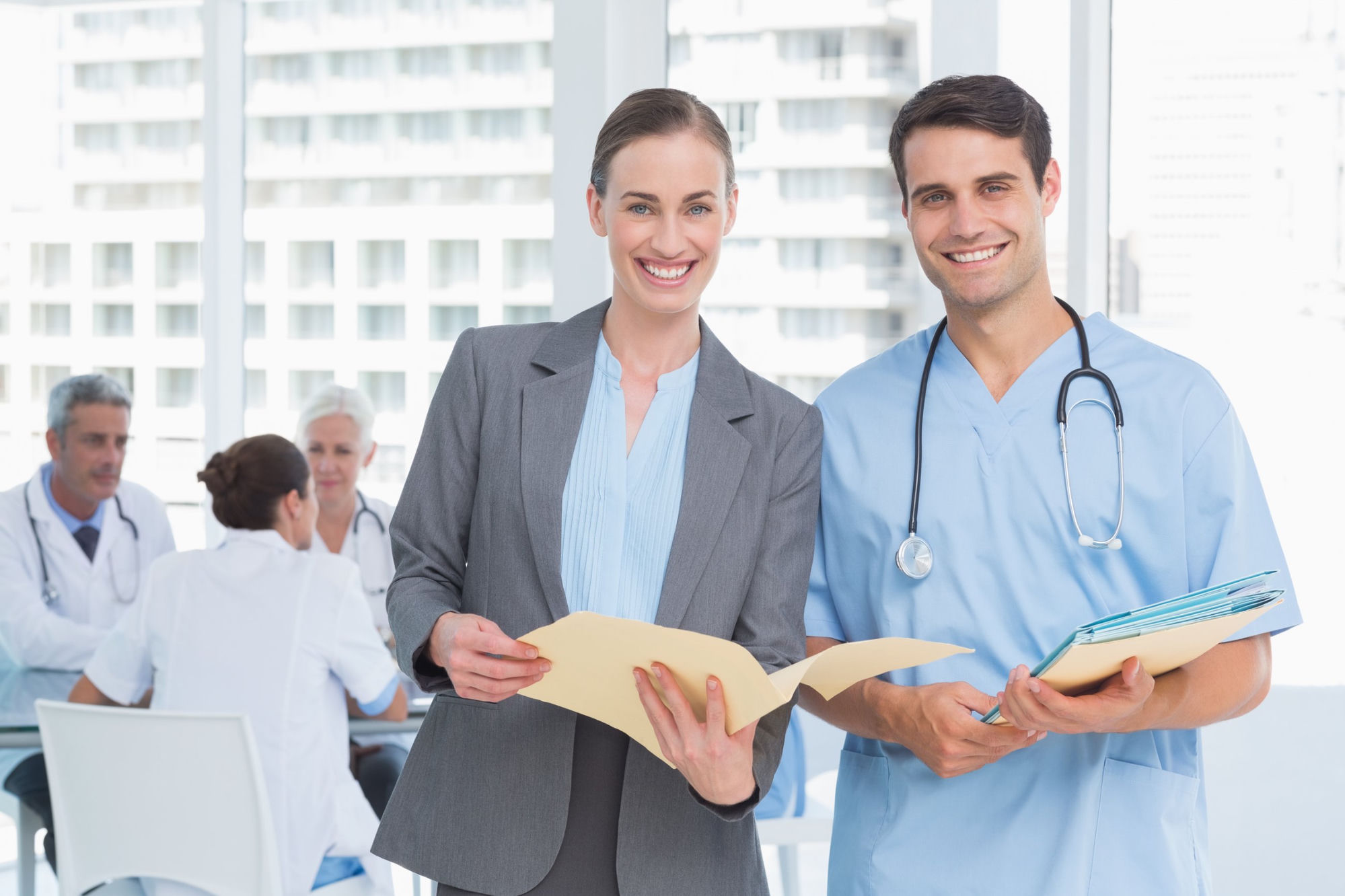 HR partner and clinician reviewing credentials &mdash; eCareHRMS healthcare HR platform